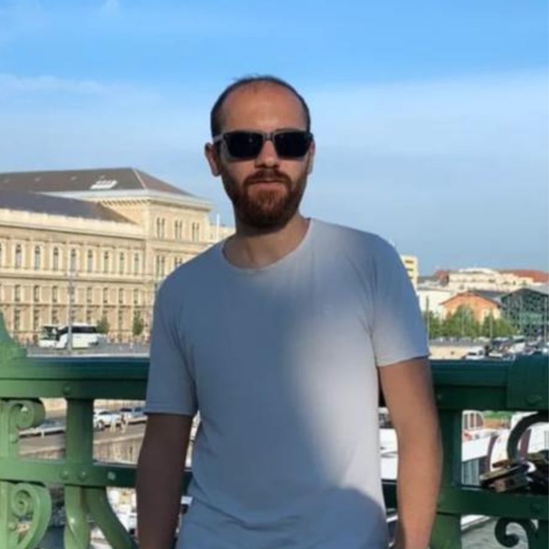 United Vision Türkiye's Environmental Educator Ibrahim Esmer standing in white T-Shirt wearing glasses