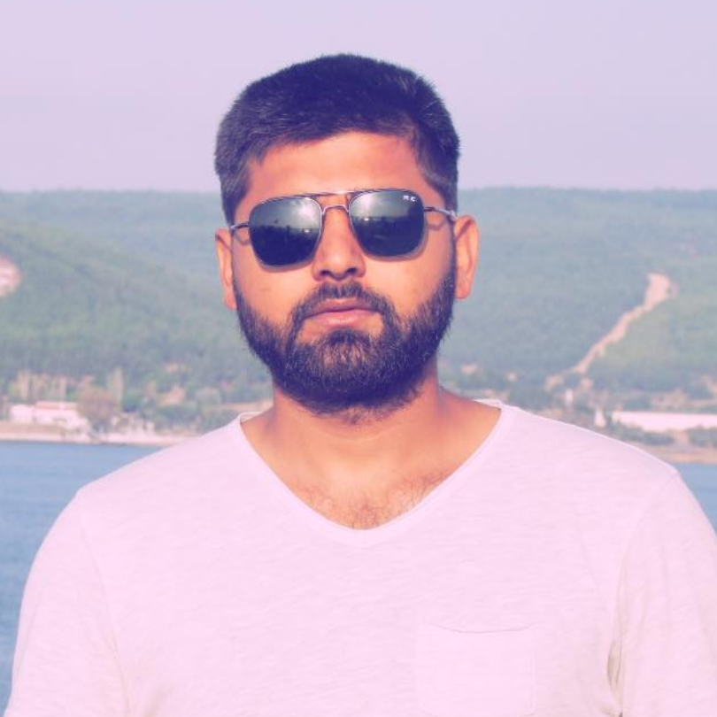 United Vision Türkiye's General Secretary Aras Kaplan standing wearing glasses in the open sky somewhere near the river